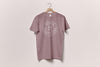House 81 lavender colored t-shirt with badge brand logo.